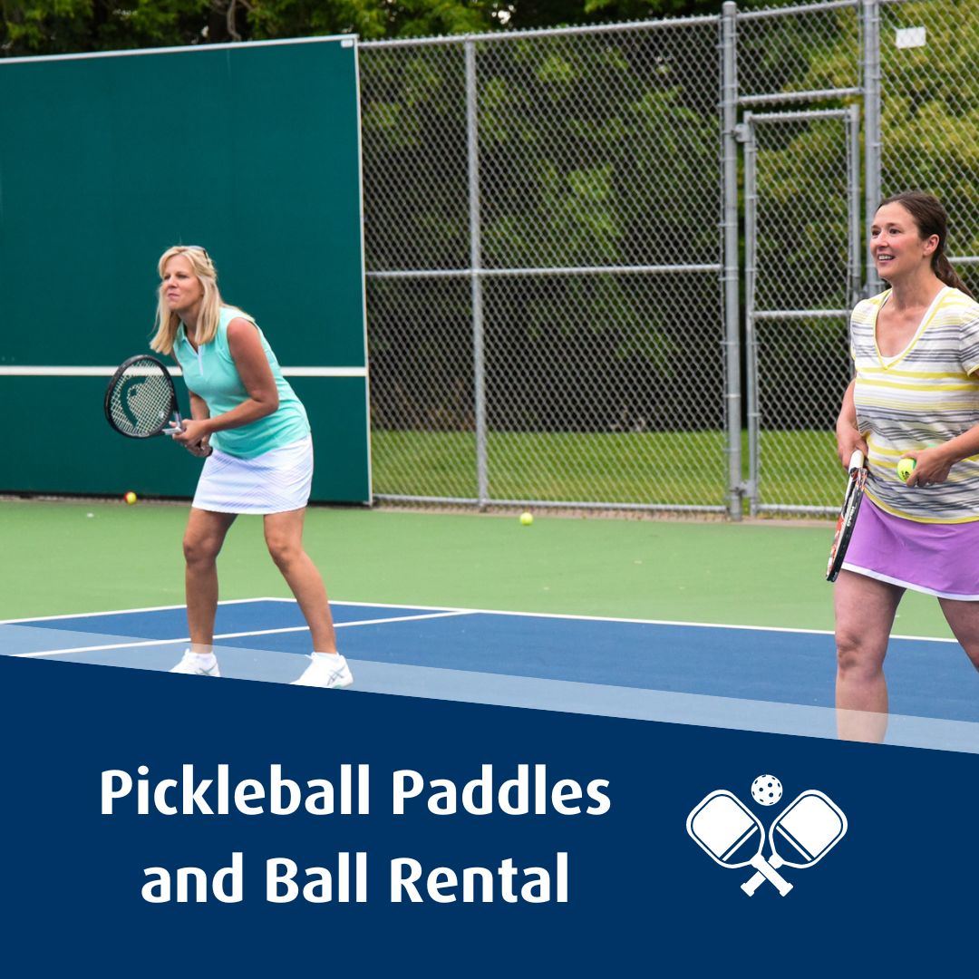 Two women smiling playing pickleball Text: Pickleball Paddles and Ball Rental