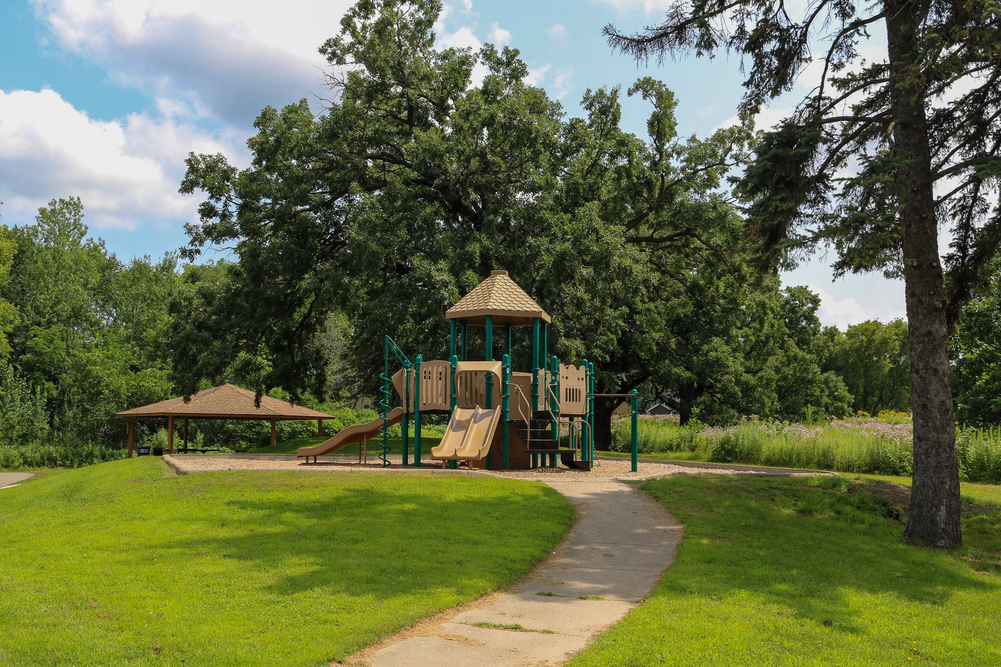 Day Park playground amongst green space and trees