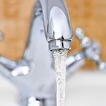 Water pouring from faucet