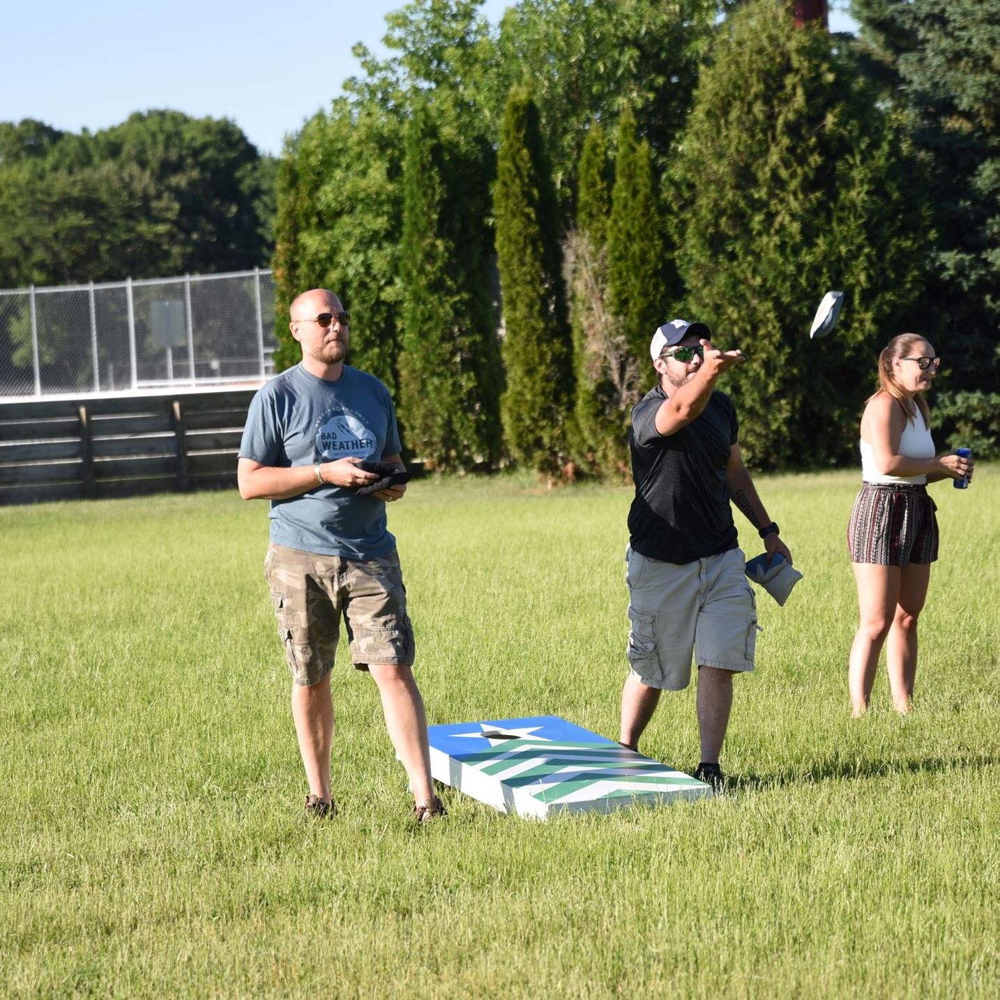 bean bag teams tossing bean bags